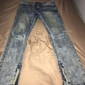 ripped denim jeans with zippers